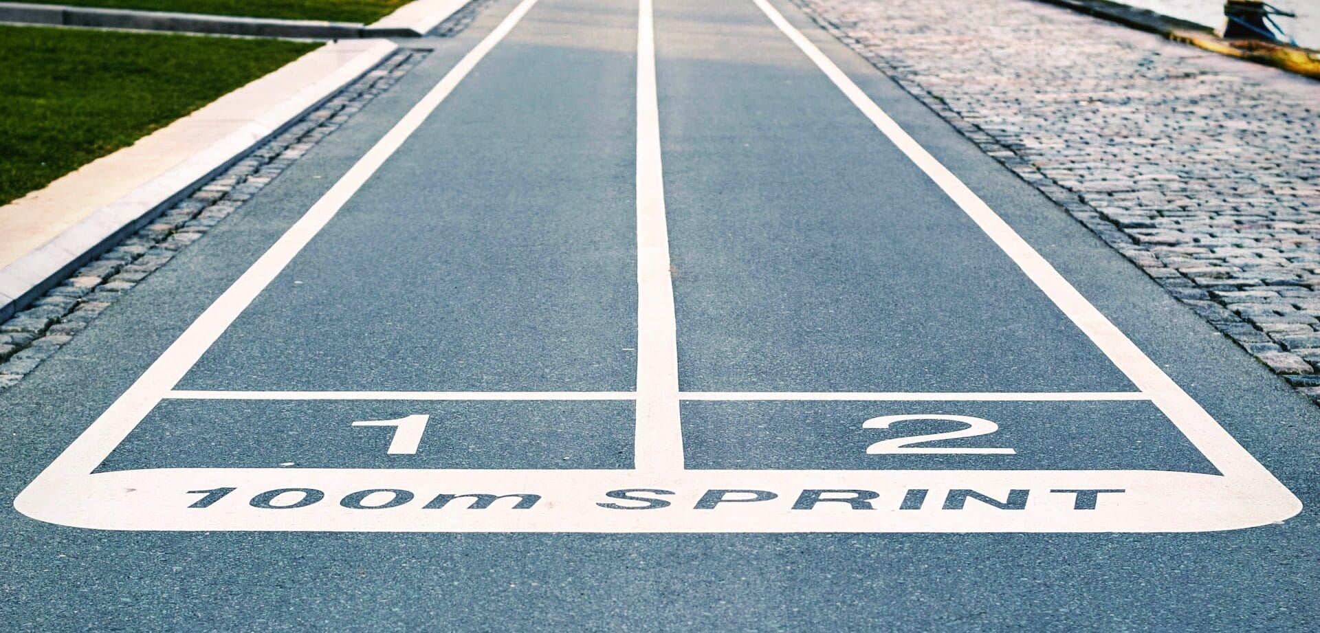 A running track with the word sprint written on it, showcasing the development of a new website using Webflow.